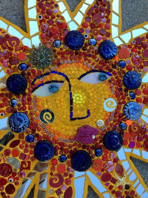 Bling Me Some Sunshine. 2013 Stained glass, glass fusions, sentimental pieces, gems, beads, mirror, tinted mortar and grout. 31